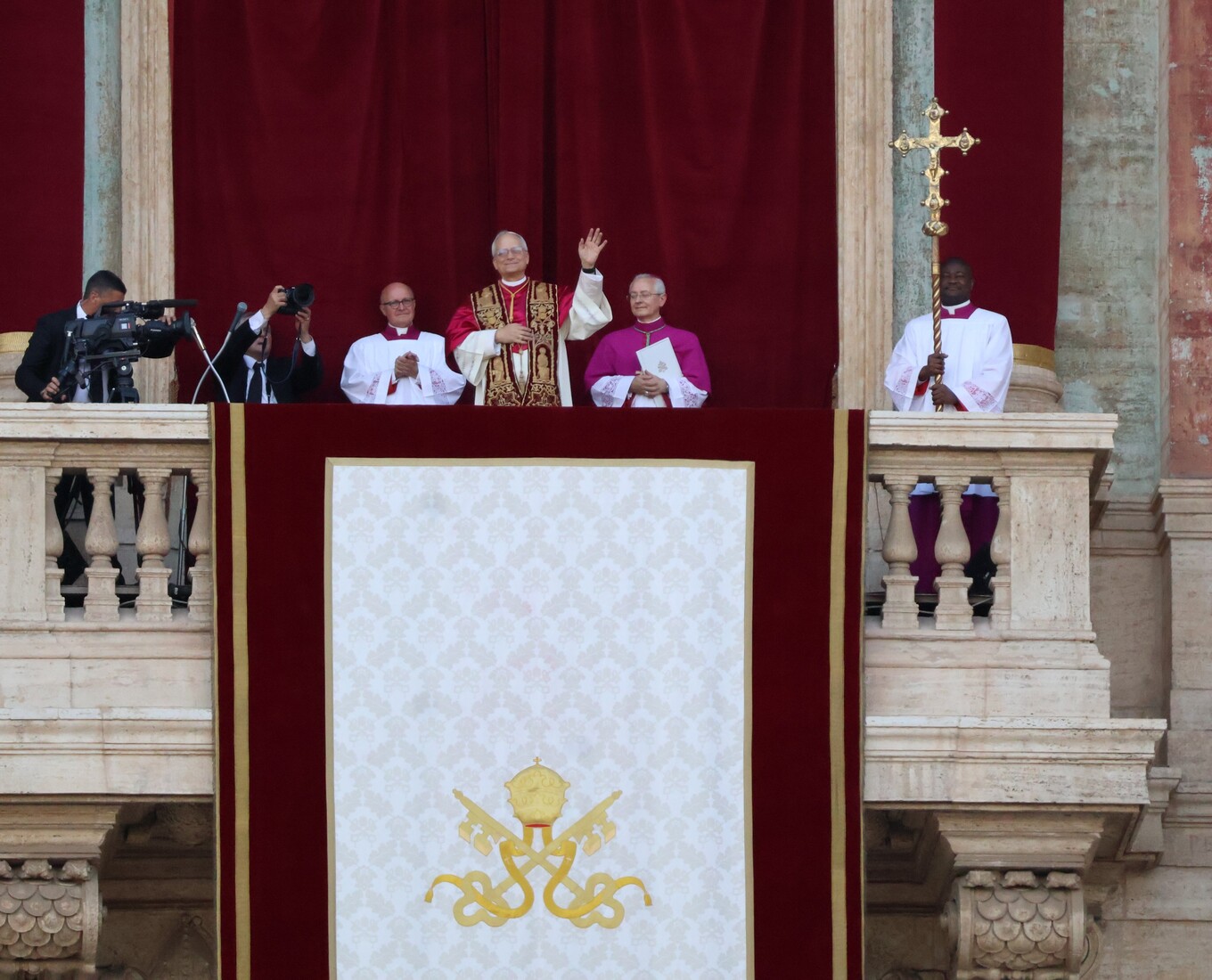 Pope stands on balcony
