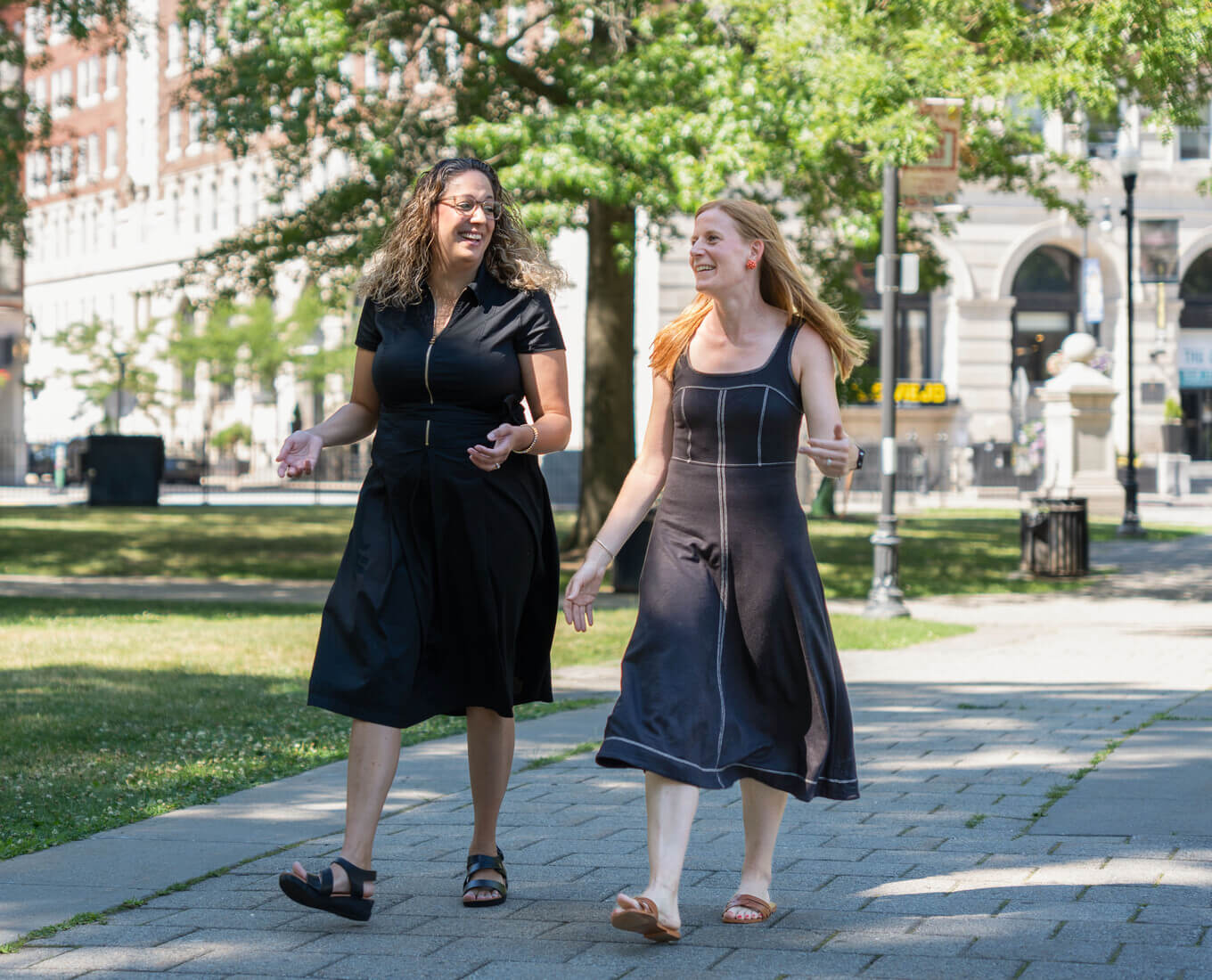 Two women walking in the Worcester Common