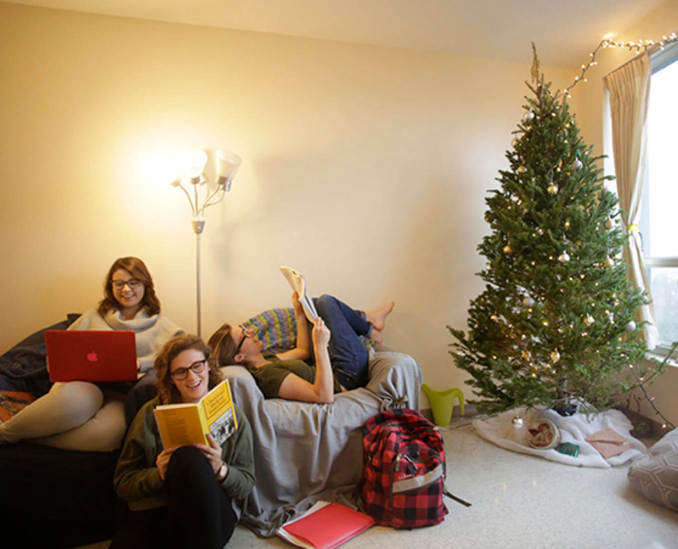 Laura Lopez '18, Emma Kuper '18 and Catherine Hershey '18 get back to studying after decorating their residence hall for Christmas.