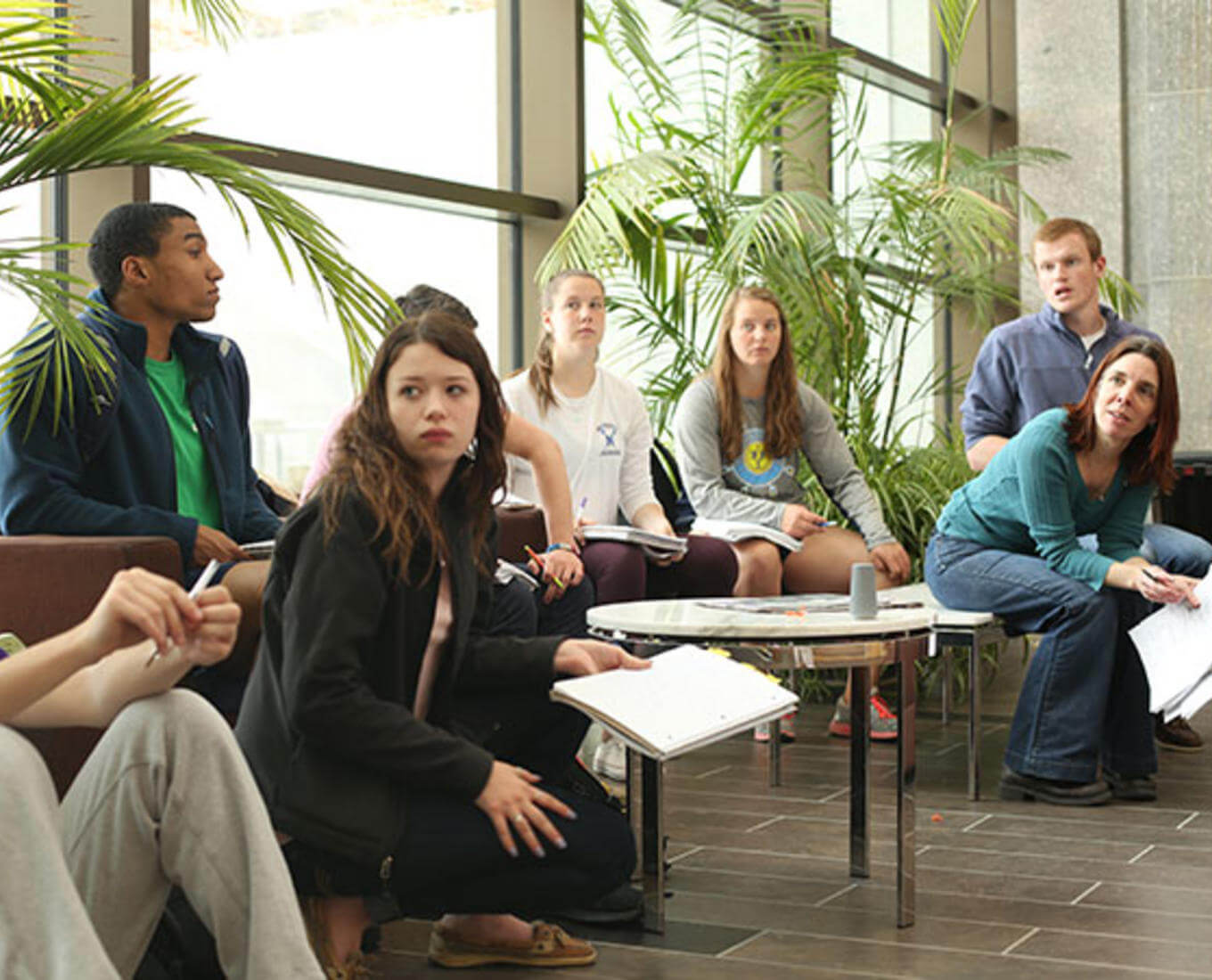 Ann Sheehy, professor of biology, is seen here leading her Montserrat class in oral presentations. Photo by Tom Rettig