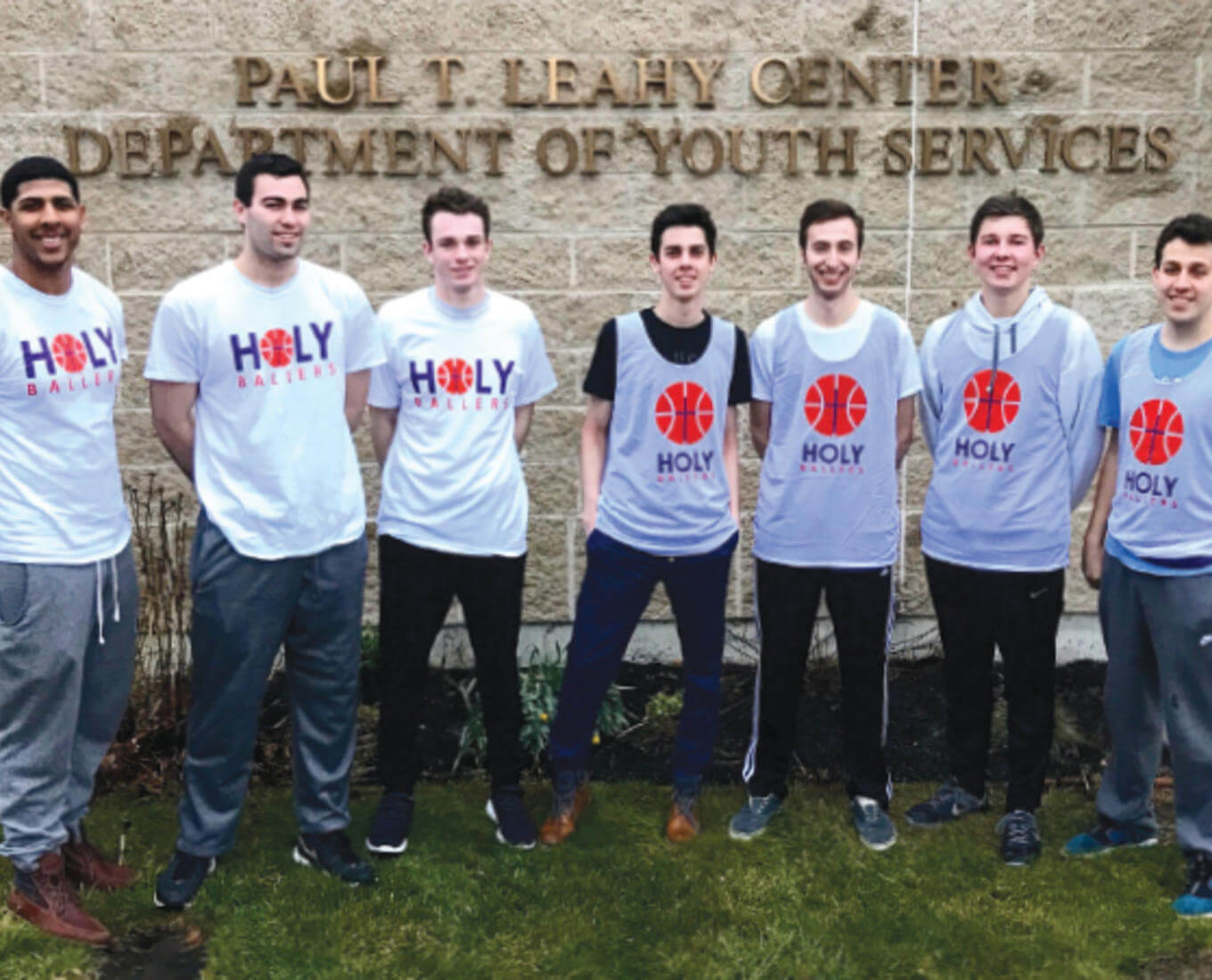 Riley Benner ’20 (center) and some of the “Holy Ballers” SPUD volunteers outside the Leahy Center in Worcester.
