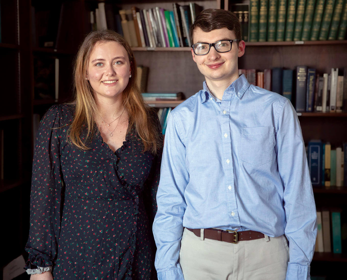Two students, a woman and man posing for a picture