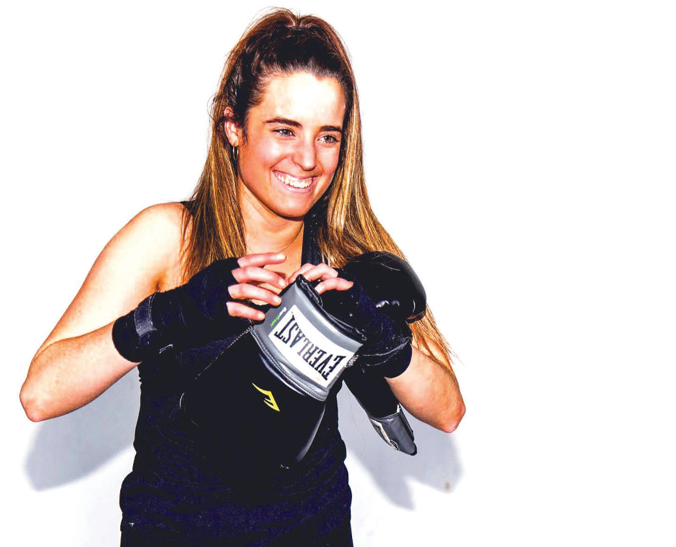 Mary Kate Vanecko ’17 posts with boxing gloves in her senior year at Holy Cross
