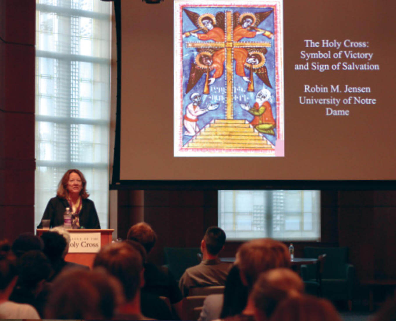 Robin Jensen speaks during a lecture on the meaning behind the imagery of the cross