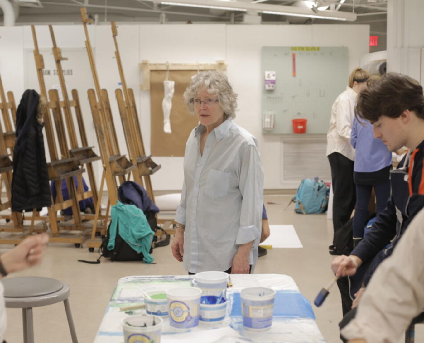 Students work on a mosaic tile project with professor Virginia Raguin.