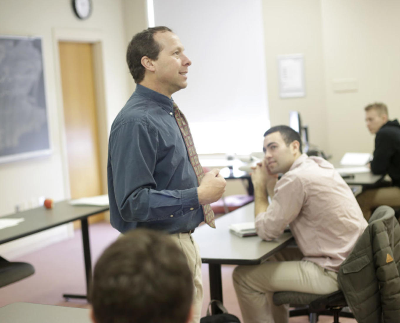 Victor Matheson, professor of economics, is seen here teaching a class at Holy Cross in 2018. Photo by Tom Rettig