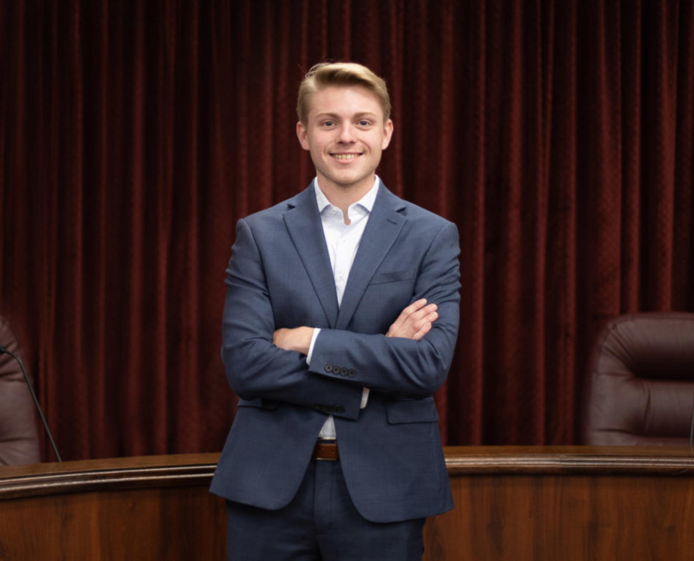 Male student dressed in suit.