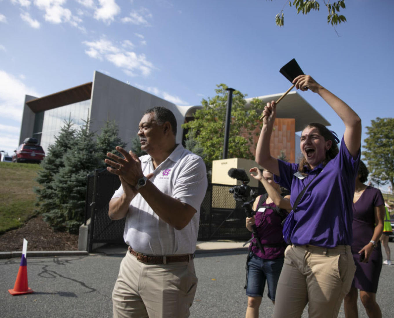 President Rougeau helps first-year students move onto campus during Class of 2026 move in day at Holy Cross on August 27, 2022. (Photo by Michael Ivins/Holy Cross)