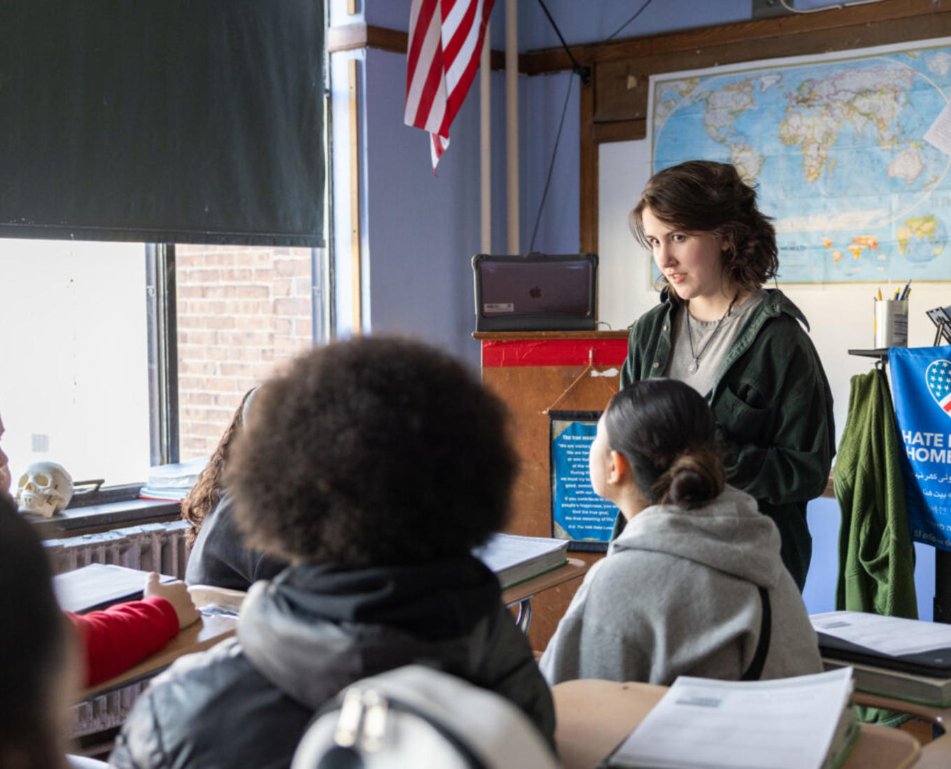 A young woman teaches a classroom of students in Worcester, MA.