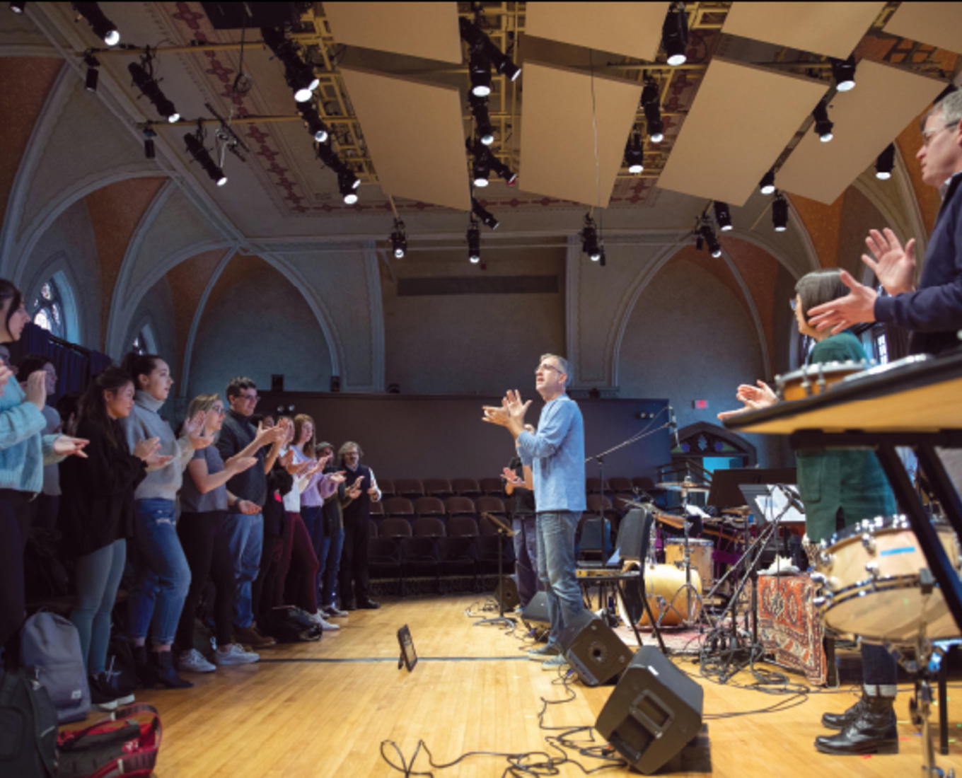 Jonathan Mulrooney speaks in front of a classroom full of students