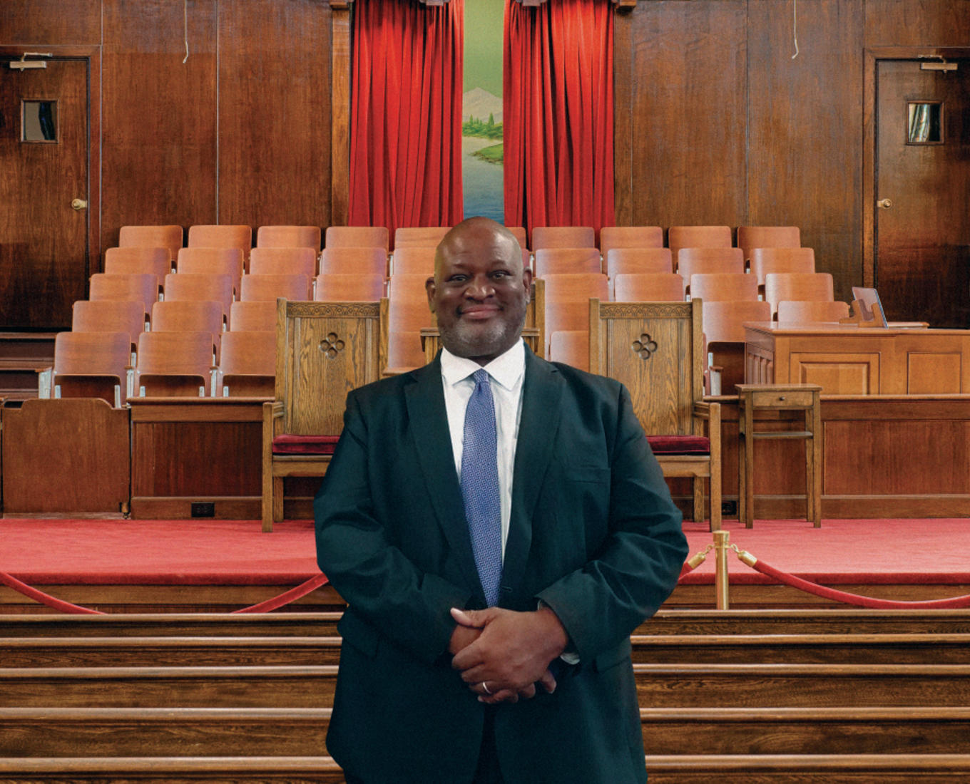 Rev. Vaughn stands in the Ebenezer Baptist Church's famous sanctuary.