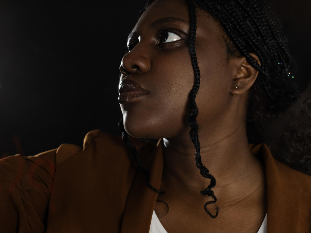 A closeup of a woman looking to the left