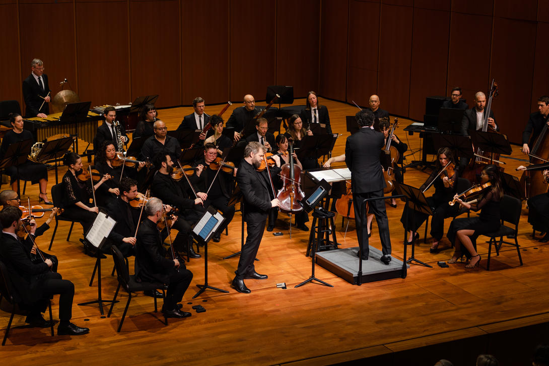 A conductor leads an orchestra.