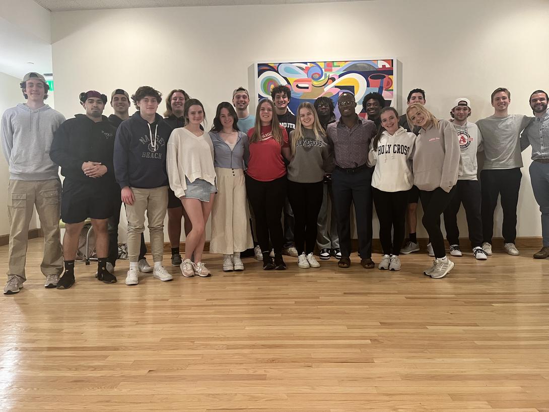 A group of young people standing together in a gallery