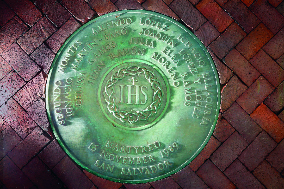 metal medallion inscribed with names installed in a brick plaza