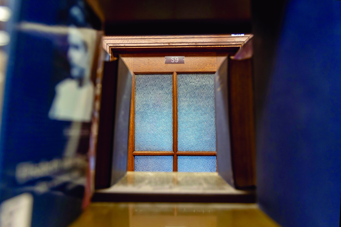 Looking at a door through the stacks