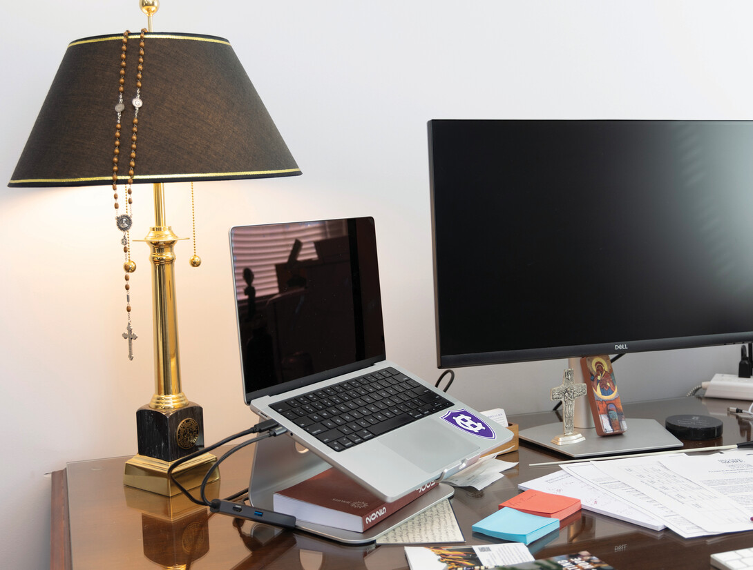 Desk surface with lamp and computer