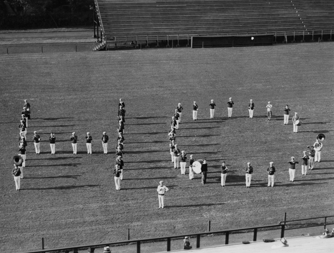 Marching band forming an "HC" on the field