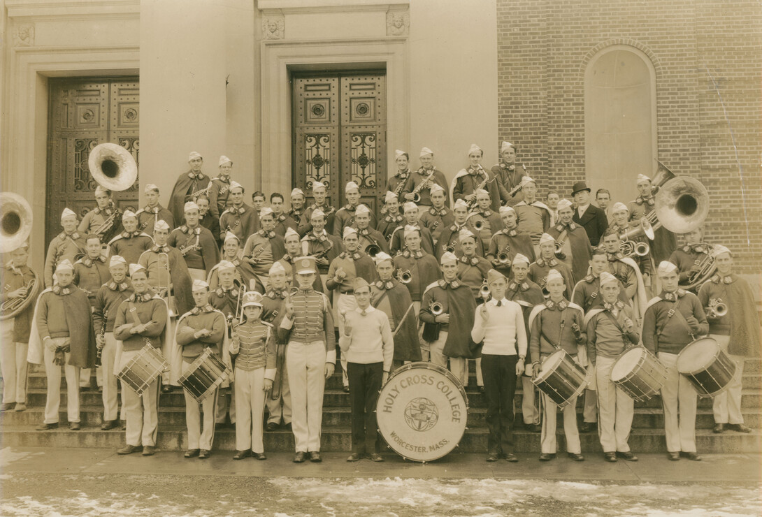 Archival photo of band on steps of Dinand Library