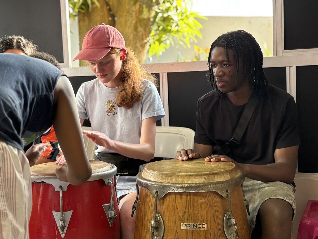 Two students playing drums