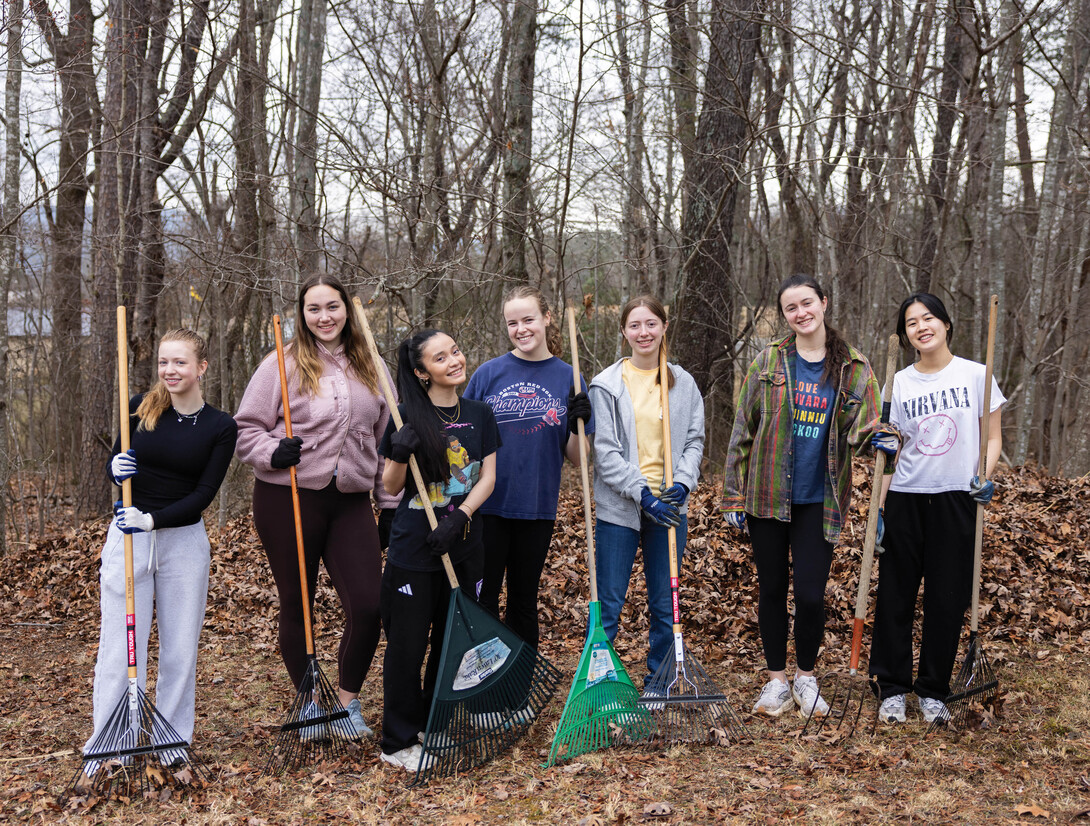 Group of girls holding rakes